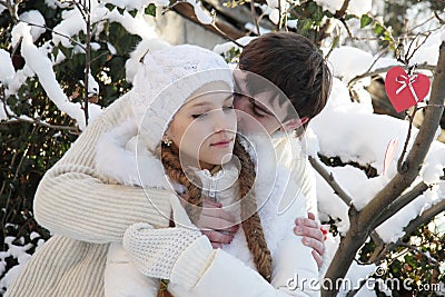 Young couple on natural winter background Stock Photo