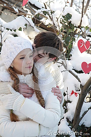 Young couple on natural winter background Stock Photo