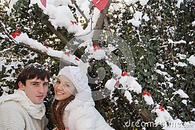 Young couple on natural winter background Stock Photo