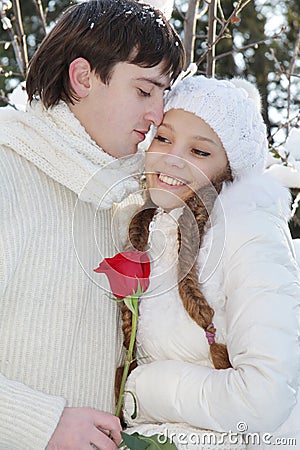 Young couple on natural winter background Stock Photo