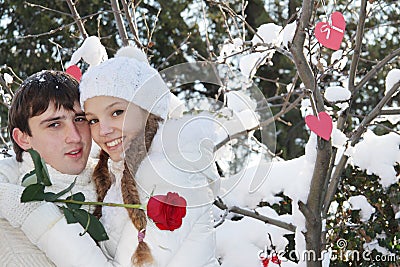 Young couple on natural winter background Stock Photo