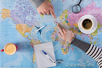 Couple planning vacation trip with map. Top view. Stock Photo