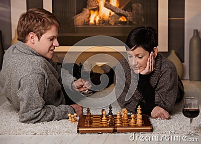 Young couple playing chess Stock Photo