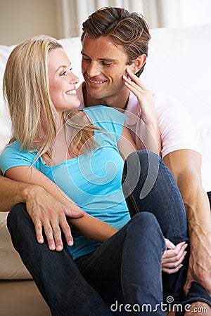 Young couple posing indoors Stock Photo