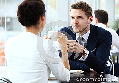 Young couple of professionals chatting during a coffeebreak Stock Photo