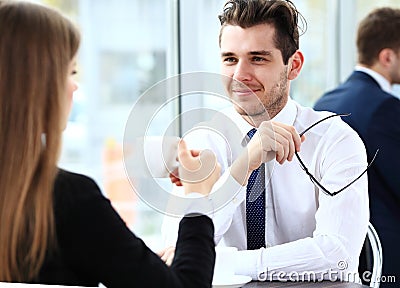 Young couple of professionals chatting during a coffeebreak Stock Photo