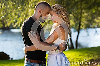 Young Couple Putting Their Heads Together Stock Photo