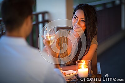Young couple with a romantic dinner with candles Stock Photo