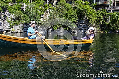 Young Couple in a Row Boat Editorial Stock Photo