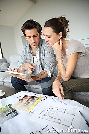 Young couple searching for ideas of decoration Stock Photo