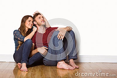 Young couple sitting on floor Stock Photo