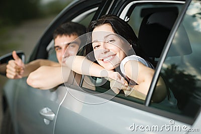 Young couple sitting in the new car Stock Photo