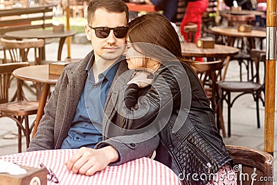 Young couple sitting at the street cafe having romantic date Stock Photo