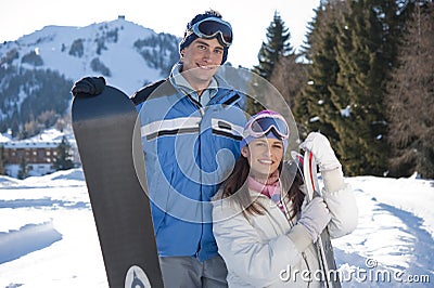 Young couple of snowboarders Stock Photo