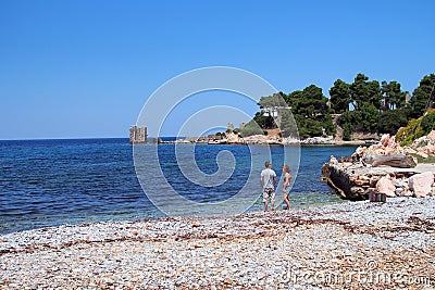 Couple on Rocky Beach, Skyros Greek Island, Greece Editorial Stock Photo
