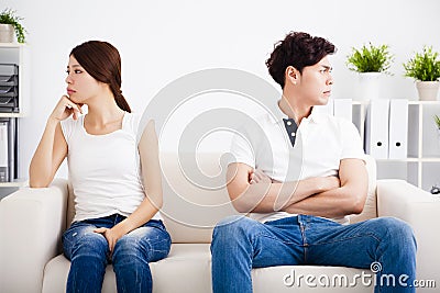 Young Couple stress and sitting on the sofa Stock Photo