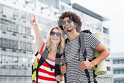 Young couple in sunglasses standing on terrace Stock Photo