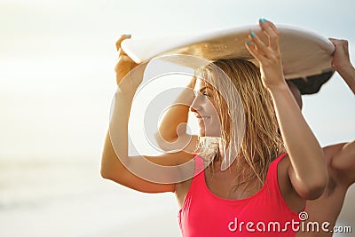 Young couple with a surfboard Stock Photo