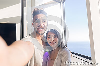 Young Couple Taking Selfie Photo Embracing Asian Woman And Hispanic Man Happy Smiling Stock Photo