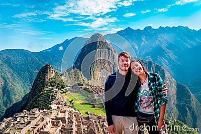 Young couple of tourist in Machu Picchu. They are together, happy and relaxed. Stock Photo