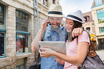 Young couple of tourists booking hostel Stock Photo