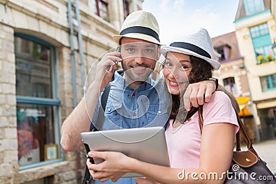 Young couple of tourists booking hostel Stock Photo