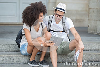 Young couple tourists planning their day Stock Photo