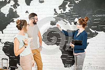 Couple with travel agent at the office Stock Photo