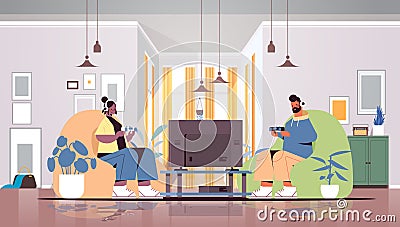 Young couple using joysticks playing video games on tv man woman spending time together at home Vector Illustration