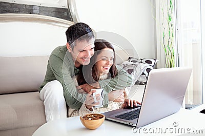 Young couple using laptop Stock Photo