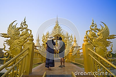 Young couple are visiting and sightseeing at Wat Rong Khun in Chiangrai Editorial Stock Photo