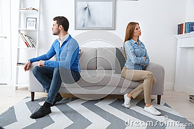 Young couple waiting for psychology session family problems turning aside from each other Stock Photo