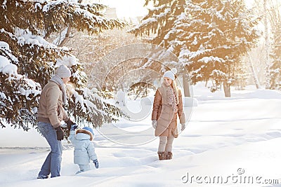 Young couple walking with a child Stock Photo