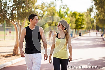 Young couple walking together outdoors Stock Photo