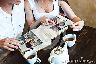 Girl pointing at the photo in the album Stock Photo