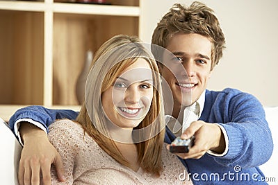 Young Couple Watching Television Together Stock Photo