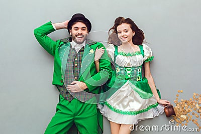 Young couple in festive costumes saint patrick`s day top view looking camera cheerful Stock Photo