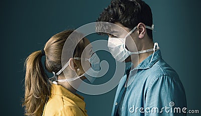 Young couple wearing a protective face mask Stock Photo