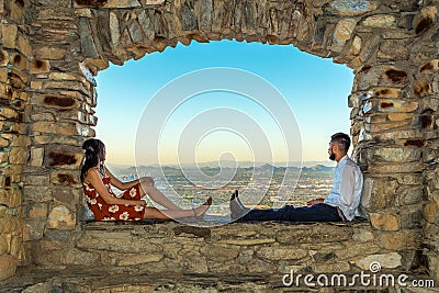 Young Couple in Window Editorial Stock Photo