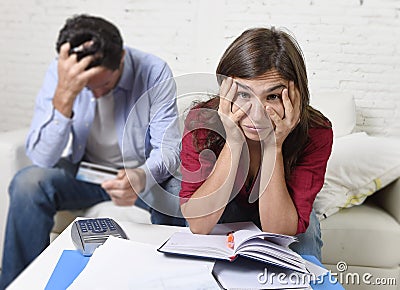 Young couple worried and desperate on money problems at home in stress accounting bank payments Stock Photo