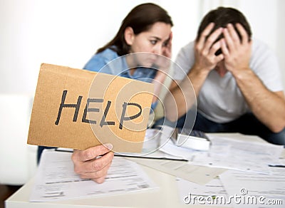 Young couple worried at home in bad financial situation stress asking for help Stock Photo