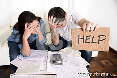 Young couple worried at home in bad financial situation stress asking for help Stock Photo