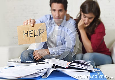 Young couple worried at home in bad financial situation stress asking for help Stock Photo