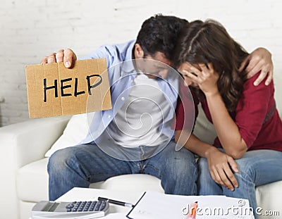 Young couple worried at home in bad financial situation stress asking for help Stock Photo