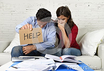 Young couple worried at home in bad financial situation stress asking for help Stock Photo