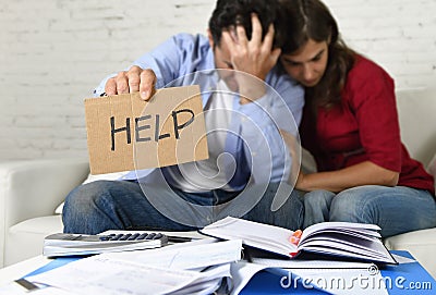 Young couple worried at home in bad financial situation stress asking for help Stock Photo