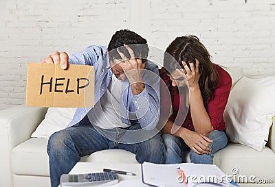 Young couple worried at home in bad financial situation stress asking for help Stock Photo
