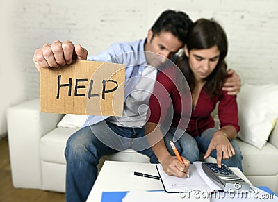 Young couple worried at home in bad financial situation stress asking for help Stock Photo