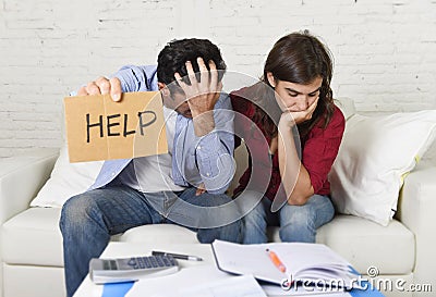 Young couple worried at home in bad financial situation stress asking for help Stock Photo