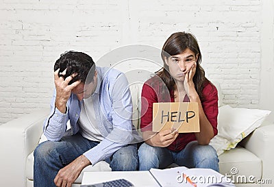 Young couple worried at home in bad financial situation stress asking for help Stock Photo